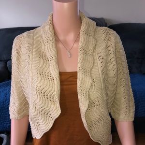 INC tan cover up with gold flex throughout.